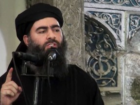 A file image made from  a video posted on a militant website Saturday, July 5, 2014, purports to show the leader of ISIL, Abu Bakr al-Baghdadi