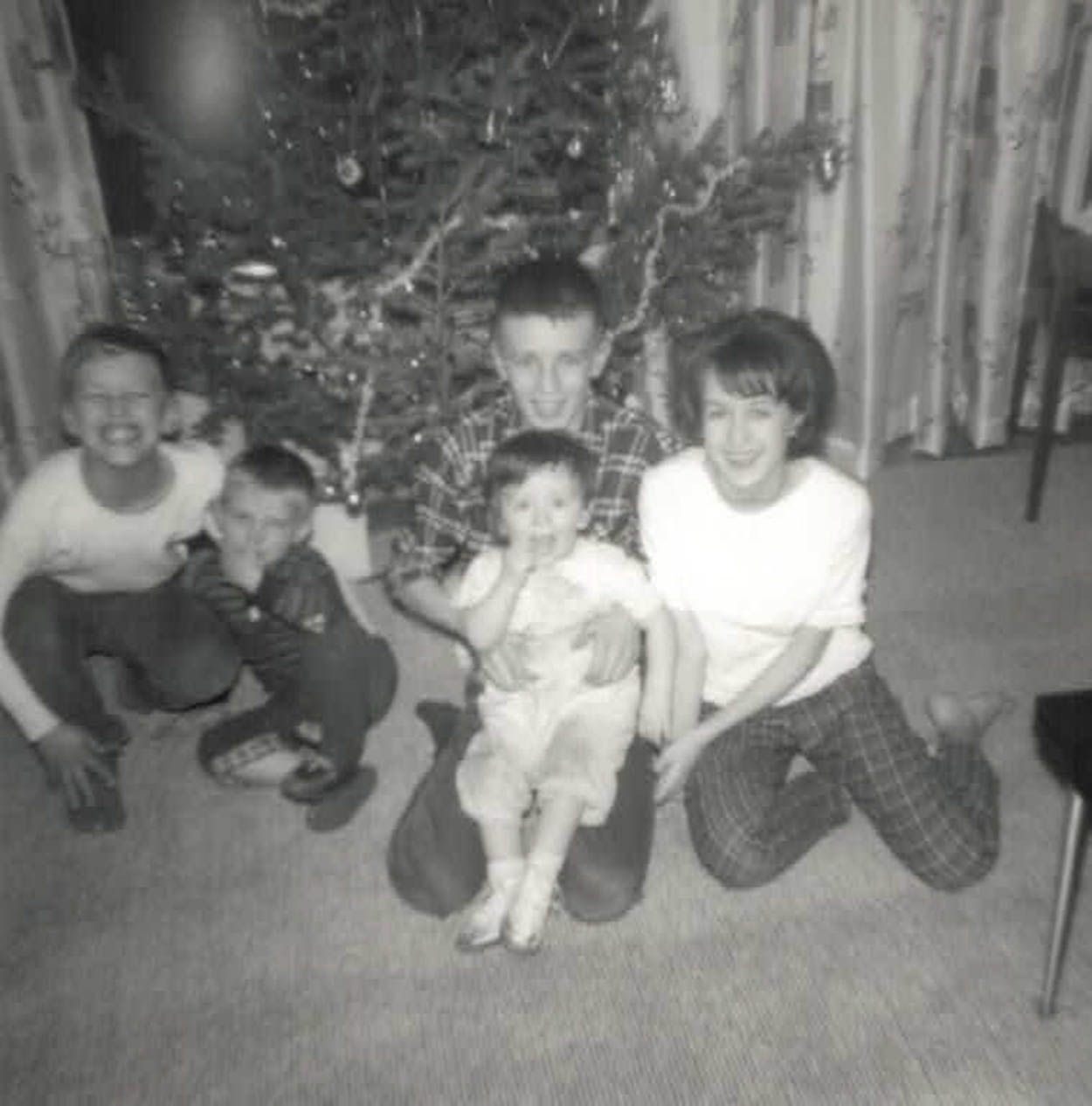 Tom, in the middle, holding his little sister Anna-Marie. His older sister Theresa is to his left and Mike and Pat are to his right. (Courtesy Mike Sweetnam)