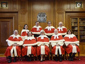 Supreme Court justices pose for a group photo in 2015.