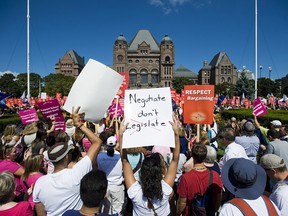 A 2012 protest by Ontario teachers at Queen's Park. The governing Liberals imposed contracts on teachers in 2012 that froze some of their wages and limited their ability to strike.