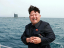 This undated picture released from North Korea's official Korean Central News Agency (KCNA) on May 9, 2015 shows North Korean leader Kim Jong-Un smiling while observing an underwater test-fire of a submarine-launched ballistic missile at an undisclosed location at sea. 