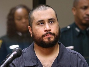 In this 2013 photo George Zimmerman, acquitted in the high-profile killing of unarmed black teenager Trayvon Martin, listens in court, in Sanford, Fla., during his hearing. A fight allegedly broke out in Florida after Zimmerman bragged about killing Trayvon Martin.