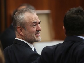 Nick Denton, founder of Gawker, talks with his legal team before Hulk Hogan testifies in court on Tuesday, March 8, 2016