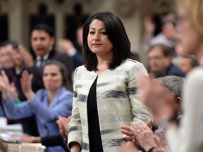 Democratic Institutions Minister Maryam Monsef is applauded by her party as she responds to a question during question period in the House of Commons on Parliament Hill in Ottawa on Wednesday, May 11, 2016.