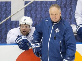 Former Toronto Maple Leafs coach Randy Carlyle (right) and forward Phil Kessel before the start of the 2014-15 season.