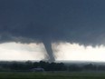 This image made from a video taken through a car window shows a tornado near Wynnewood, Okla., Monday, May 9, 2016.