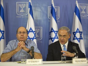 Israeli Prime Minister Benjamin Netanyahu and former Defense Minister Moshe Ya'alon, who was replaced following repeated clashes with the prime minister.: