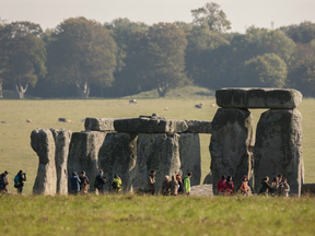 Visitors at the ancient neolithic monument of Stonehenge on October 13, 2015 in Wiltshire, England.