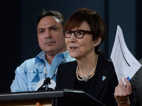 Cindy Blackstock, executive director of the First Nations Child and Family Caring Society of Canada. Assembly of First Nations National Chief Perry Bellegarde is seen behind her.