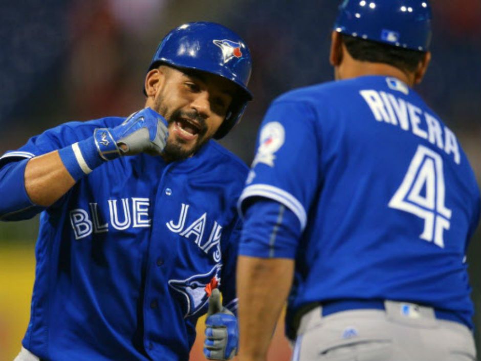 Devon Travis of the Toronto Blue Jays stands in the dugout prior