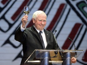 Governor General David Johnston raises his glass in a toast to the 150th anniversary of the Parliamentary Press Gallery, at the annual Press Gallery Dinner at the Museum of Nature on Saturday, June 4, 2016 in Gatineau, Quebec.