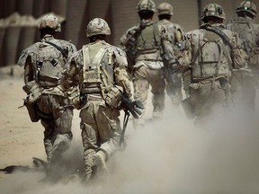 Canadian soldiers patrol southwest of Kandahar, Afghanistan, on June 7, 2010.