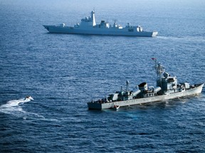 Crew members of China's South Sea Fleet take part in a drill inthe Paracel Islands in the South China Sea.