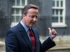 British Prime Minister David Cameron gestures as he addresses the media outside 10 Downing Street in London, when he announced that Theresa May would be Britain’s new leader.