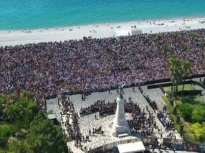 Thousands gather on Nice's Promenade des Anglais to observe a moment of silence for the victims of the Nice truck attack on July 18.