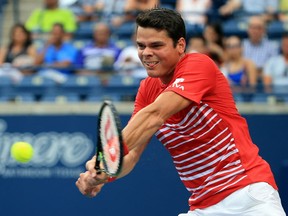 Milos Raonic plays a shot during a July Rogers Cup match in Toronto.