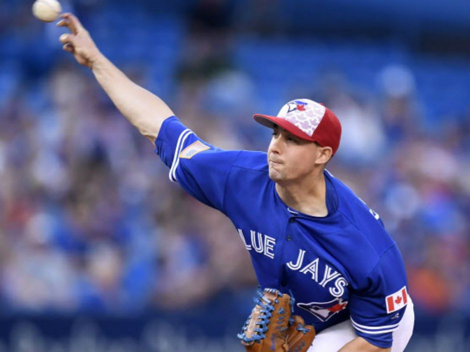 Toronto Blue Jays' Darwin Barney warms up before playing the