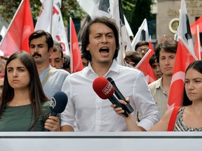 Pro-nationalist university students shout during a protest against U.S.-based cleric Fethullah Gulen and his followers during a demonstration in Ankara, on July 21, 2016. Turkish authorities on July, 21 imposed a three-month state of emergency, strengthening powers to round up suspects accused of staging the failed military coup despite global alarm over a widening purge