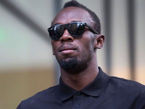 Jamaican sprinter Usain Bolt poses for photographers ahead of a press conference in London on July 21, 2016.