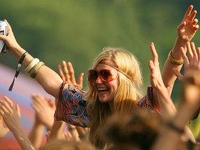 A fan watches a show at  Glastonbury Festival in England