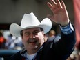 Alberta Conservative MP Jason Kenney waves to the crowd during the Calgary Stampede parade in Calgary, Friday, July 8, 2016