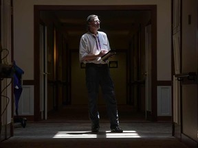 Craig Phillips, an end-of-life doula with Gilchrist Hospice Care in Baltimore, pauses before entering the room of a dying patient.