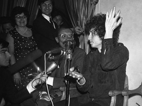 Bob Dylan gestures during a press conference in Paris, France. Dylan's tumble from his Triumph in Woodstock, N.Y., 50 years ago on July 29, 1966, was the most analyzed motorcycle crash in pop-culture history. But for all its importance, details surrounding the crash remain foggy