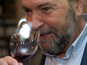 NDP leader Tom Mulcair tastes wine during a federal election campaign stop in September 2015.