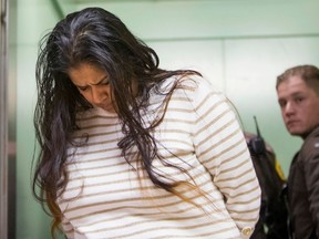 In this March 30, 2015 file photo, Purvi Patel is taken into custody at the St. Joseph County Courthouse in South Bend, Ind., after being sentenced to 20 years in prison for feticide and neglect of a dependent.