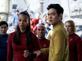 Zoe Saldana, left, as Uhura and John Cho as Sulu appear in a scene from, "Star Trek Beyond." The movie released in Canada on July 22, 2016.