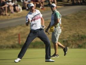 Jared du Toit, of Canada, celebrates after sinking an eagle putt on the 18th hole during the third round of the Canadian Open in Oakville on Saturday.