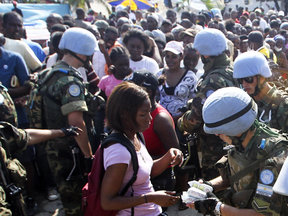 United Nations soldiers hand out food in Port-au-Prince, Haiti in 2010.