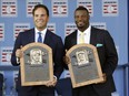 National Baseball Hall of Fame inductees Mike Piazza, left, and Ken Griffey Jr. hold their plaques after an induction ceremony  on Sunday in Cooperstown, N.Y.