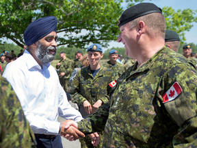 Defence Minister Harjit Sajjan meets with soldiers at CFB Gagetown in New Brunswick in June.