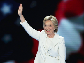 Hillary Clinton waves to the crowd as she arrives on stage during the final day of the Democratic National Convention, July 28, 2016 in Philadelphia.