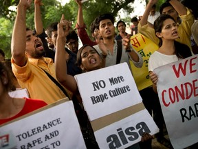In this October 2015 file photo, Indian youth shout slogans during a protest against incidents of rape in New Delhi, India.