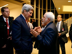 Iranian Foreign Minister Mohammad Javad Zarif speaks with U.S. Secretary of State John Kerry in Vienna in January, around the time the U.S. sent Iran $400 million in cash