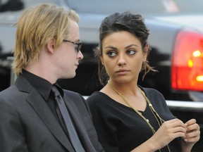 Macaulay Culkin and Mila Kunis at Michael Jackson's funeral service held at Glendale Forest Lawn Memorial Park on September 3, 2009 in Glendale, California.
