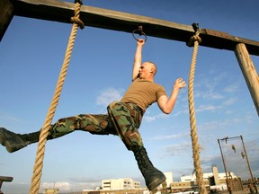 a Navy SEAL candidate swings on the Transfer Rope on the obstacle course at the Naval Special Warfare Training Center in Coronado, Calif.   Navy SEAL tryouts are strenuous as recruits attempt to join the ranks of the world’s top warfighters.