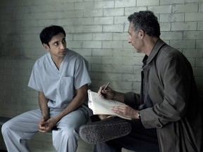 Riz Ahmed, left, and John Turturro appear in a scene from The Night Of.