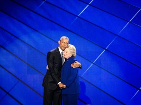 President Barack Obama hugs Democratic Presidential candidate Hillary Clinton after addressing the delegates during the third day session of the Democratic National Convention in Philadelphia.