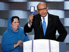 Khizr Khan, father of fallen U.S. Army Capt. Humayun Khan holds up a copy of the U.S. constitution at the Democratic National Convention. “You have sacrificed nothing and no one,” he said, addressing Donald Trump.