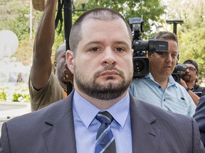 Toronto Police Services constable James Forcillo arrives at a Toronto courthouse, Thursday, for his sentencing after being found guilty of attempted murder in death of Sammy Yatim who was shot while on a TTC streetcar.