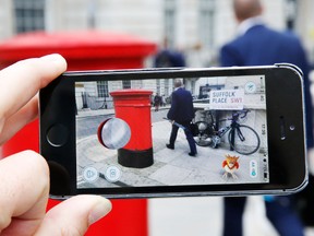 A Pokemon character appears in a London street during a game of Pokemon Go.