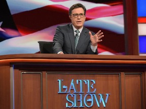 Stephen Colbert, host of "The Late Show with Stephen Colbert," appears during a broadcast in New York on Wednesday. Lawyers representing his old show company complained to CBS after Colbert revived the character he played under his own name on “The Colbert Report,"  a clueless, full-of-himself cable news host.