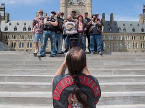 Hells Angels from Alberta pause for a photo on Parliament Hill July 23, 2016.