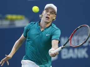 Canadian teenage sensation Denis Shapovalov returns a shot to Australia's Nick Kyrgios en route to posting a major upset at the Rogers Cup tennis championship in Toronto on Monday. Shapovalov beat the No. 11 seed Kyrgios 7-6, 3-6 and 6-3.