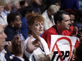 Susan Sarandon holds up a sign during the first day of the Democratic National Convention in Philadelphia , Monday, July 25, 2016.
