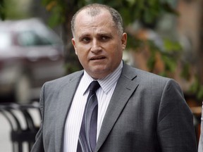 Toronto-based attorney Rocco Galati is seen outside the Federal Court Building in Winnipeg on July 16, 2012. Two lawyers have lost a court fight to be paid more for their part in challenging a controversial judicial nomination.