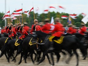 The RCMP Musical Ride performs in Ottawa last month. Many Mounties object to easing entrance standards, say two organizations representing them.